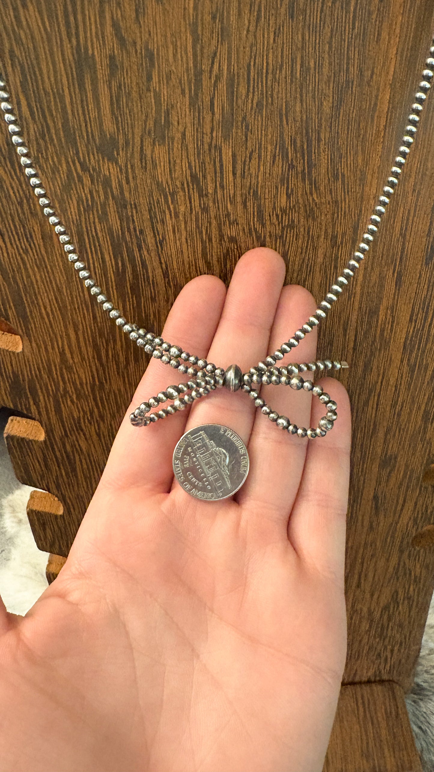 STERLING SILVER PEARL BOW NECKLACE
