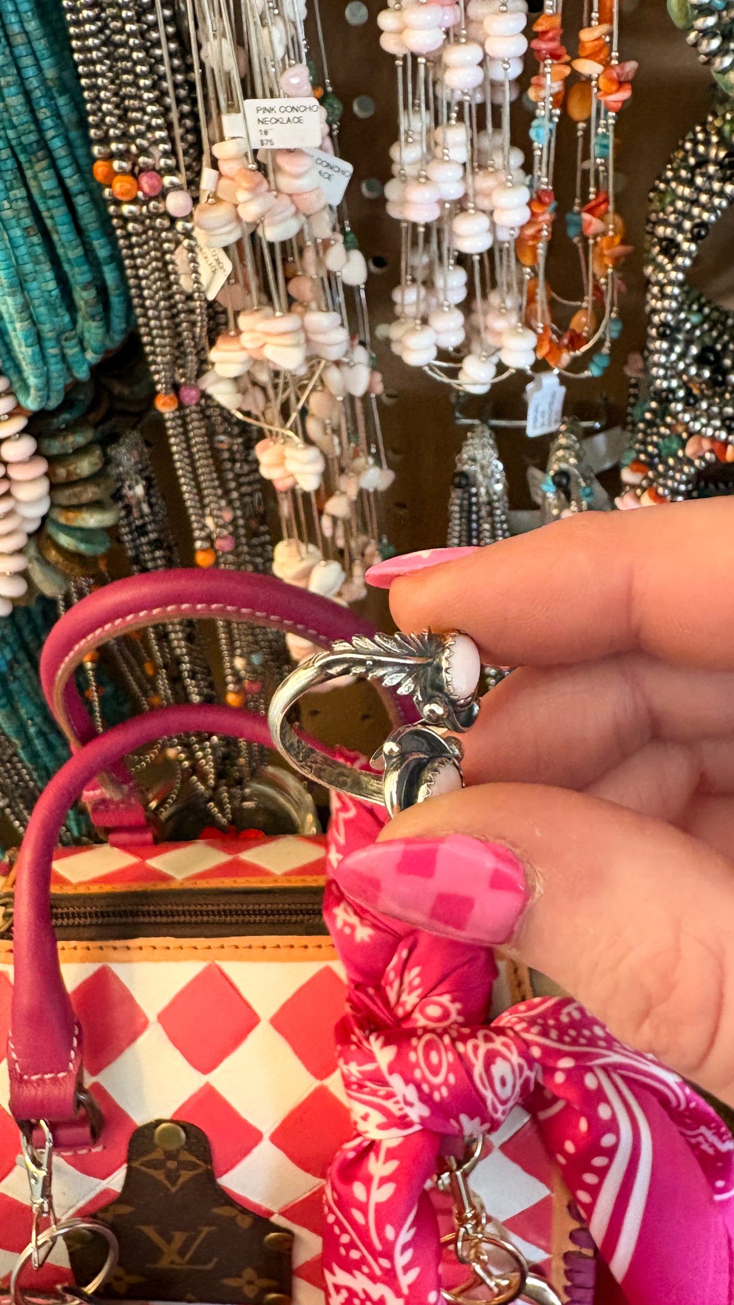 PINK CONCH ADJUSTABLE FEATHER RING BY ETTA BELIN