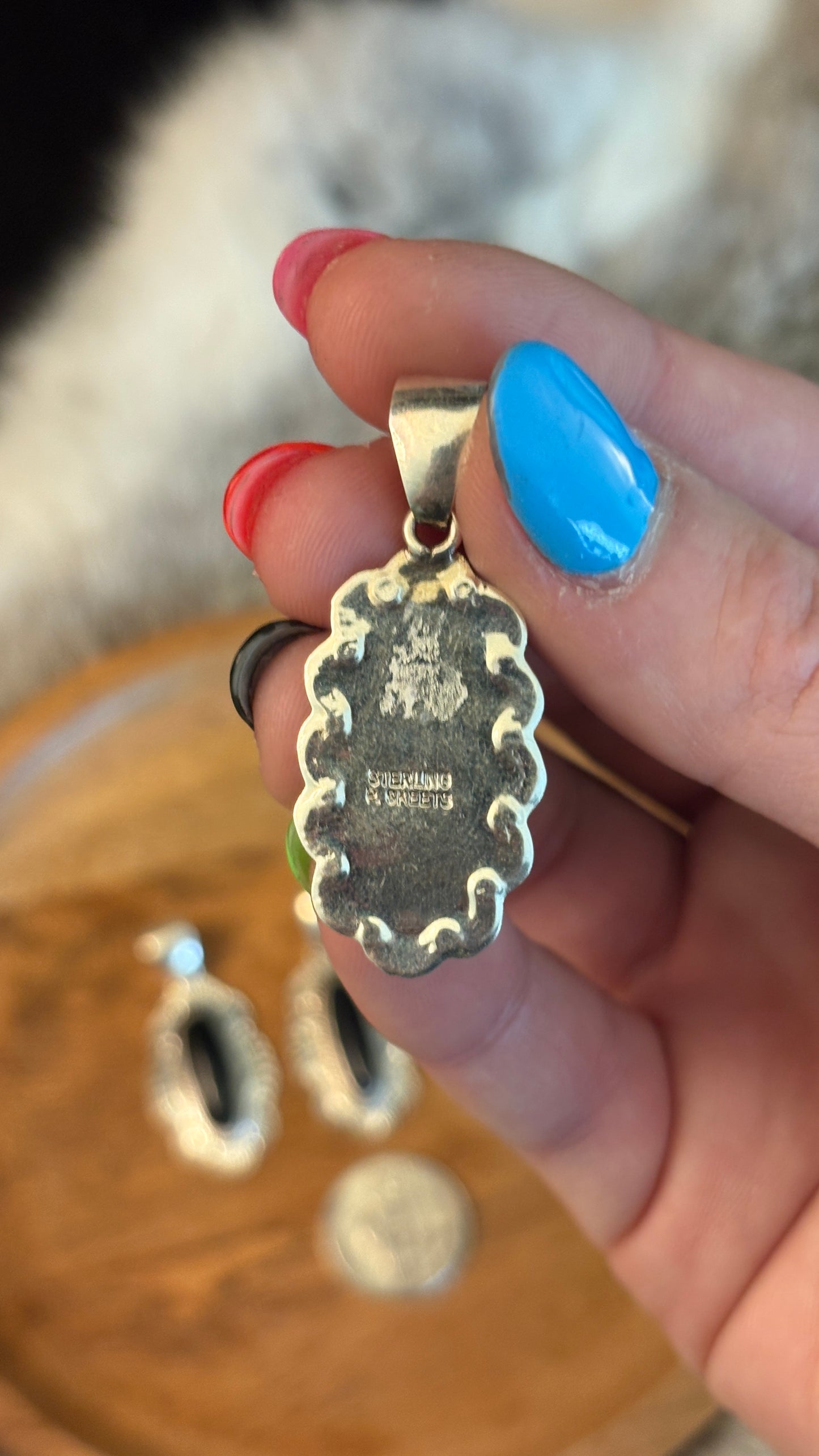 OVAL BLACK ONYX PENDANT WITH STAMPED BORDER BY PEGGY SKEETS