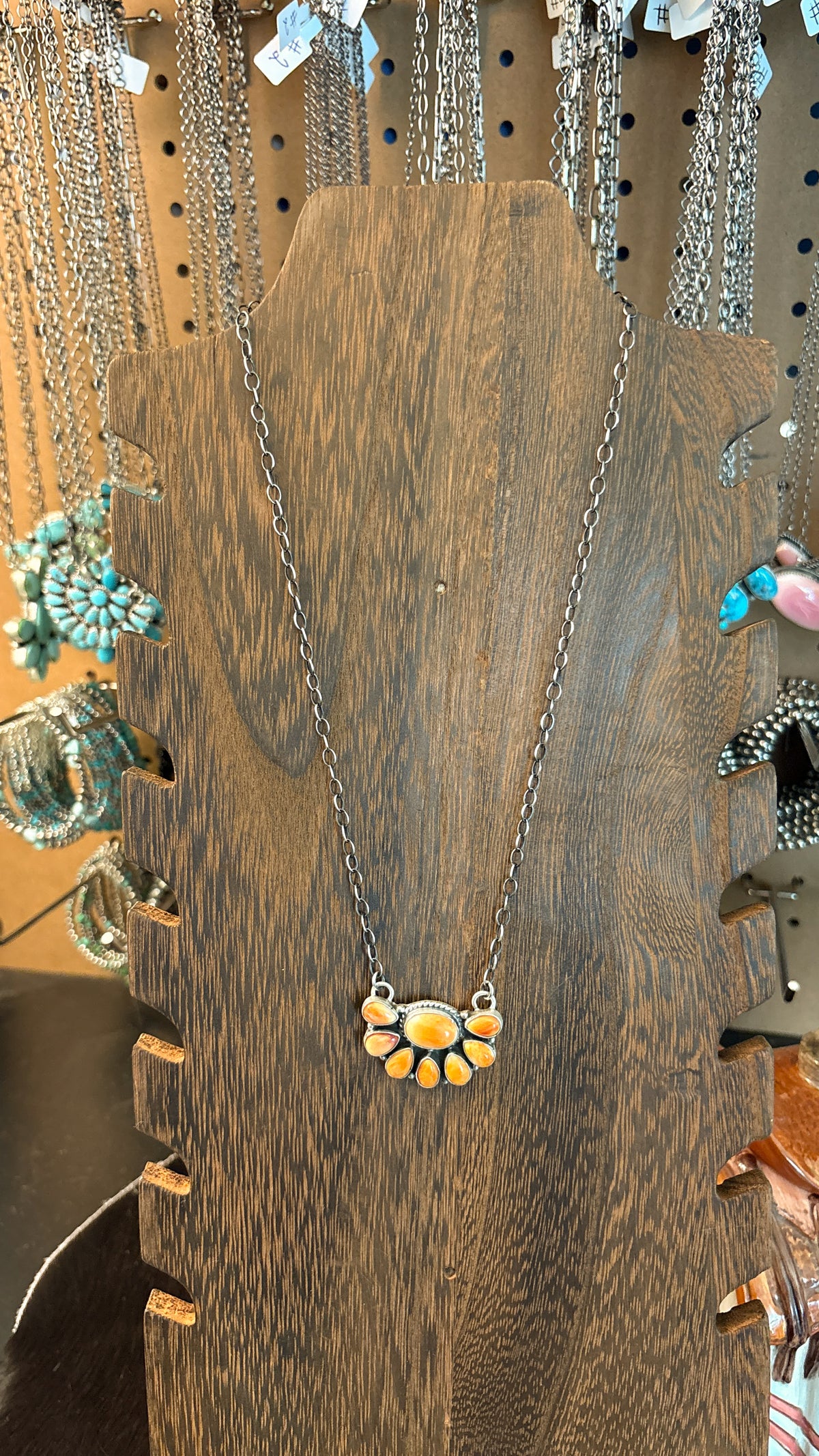 ORANGE SPINY HALF CLUSTER NECKLACE BY MARCELLA JAMES