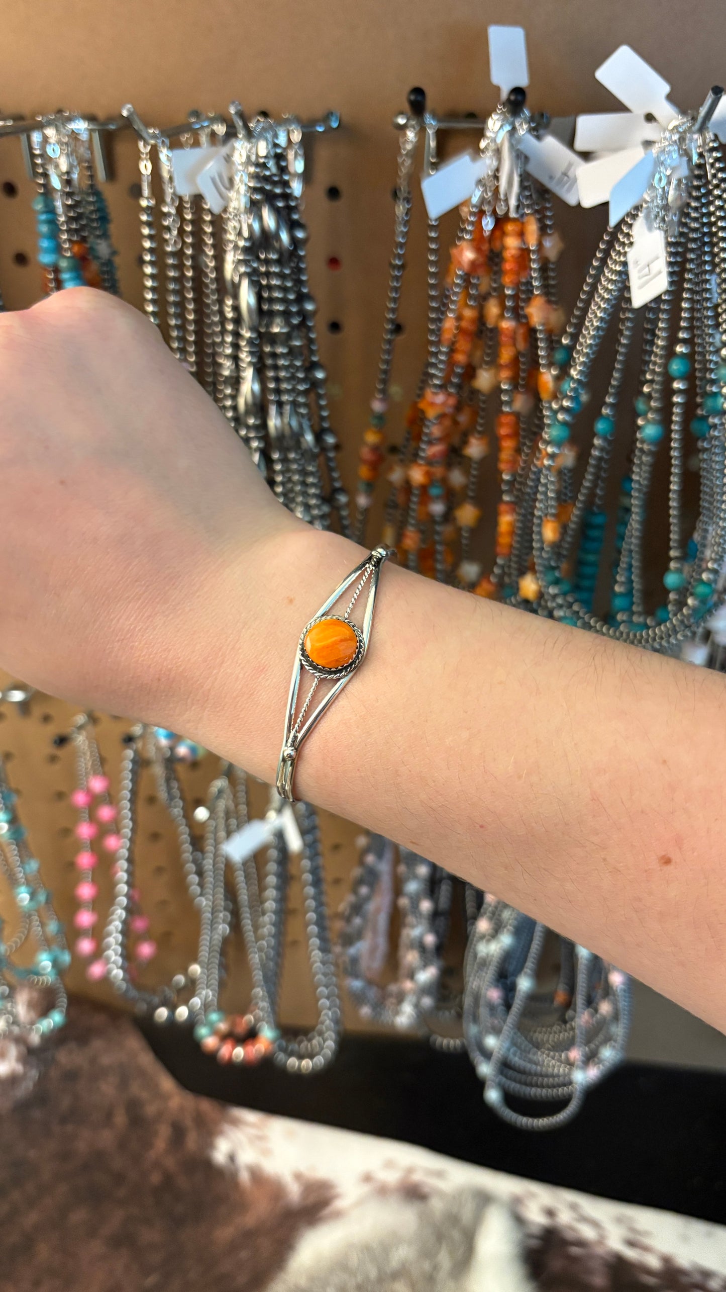 SINGLE STONE ORANGE SPINY OYSTER CUFF BY ESTHER WHITE
